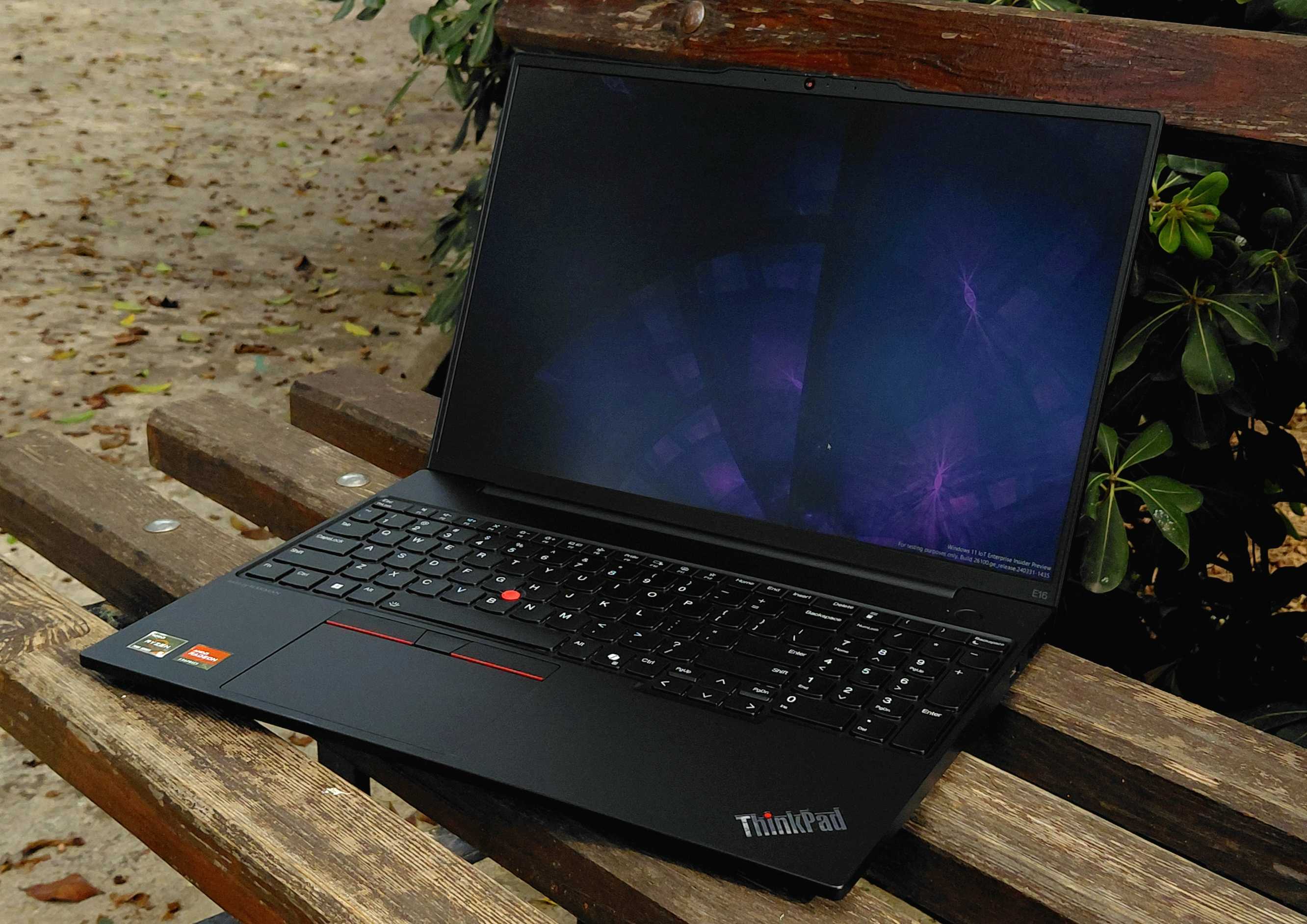 My new daily driver laptop, a 2024 Lenovo ThinkPad E16 Gen 2, shown sitting on a park bench.